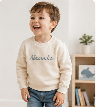 Older toddler in a personalized Nuvermi sweater