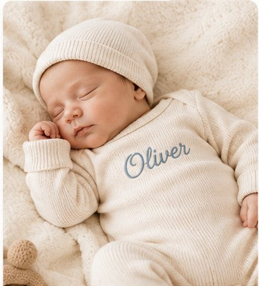 Newborn in a personalized Nuvermi outfit